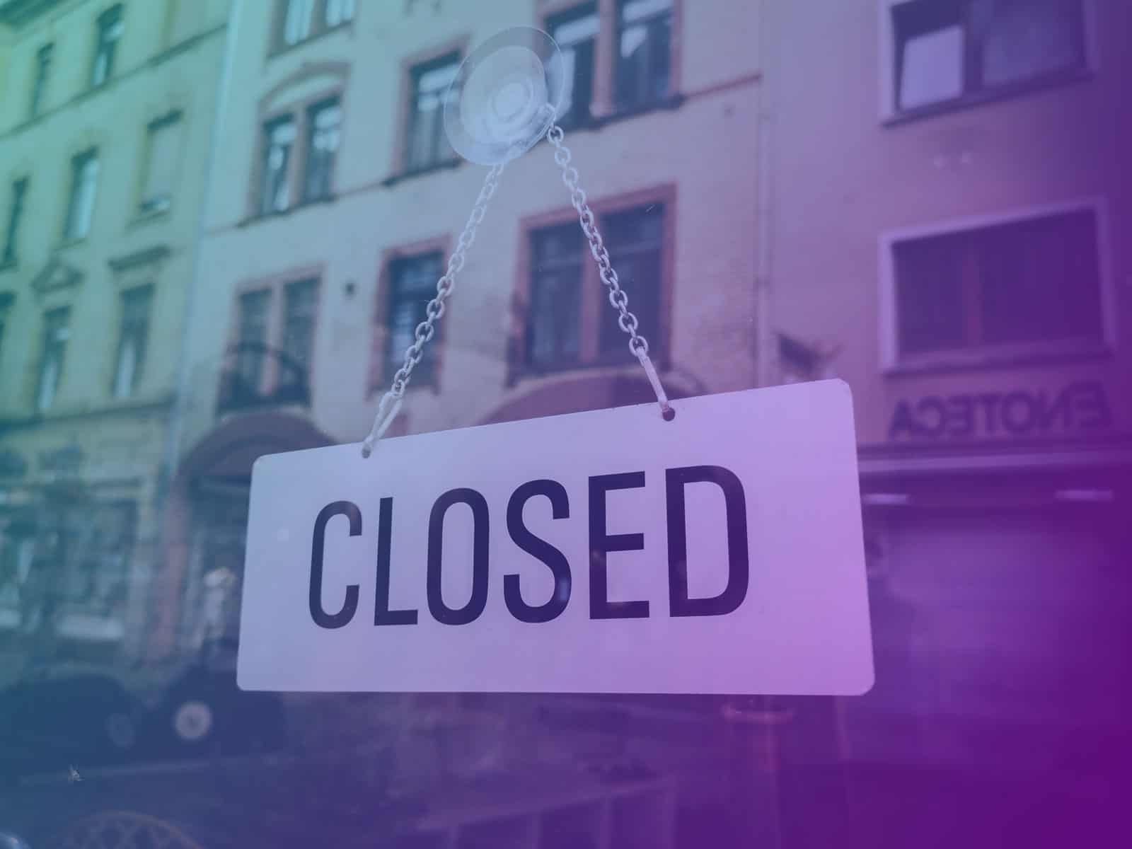 k3 closed for business - picture of a closed sign in shop window